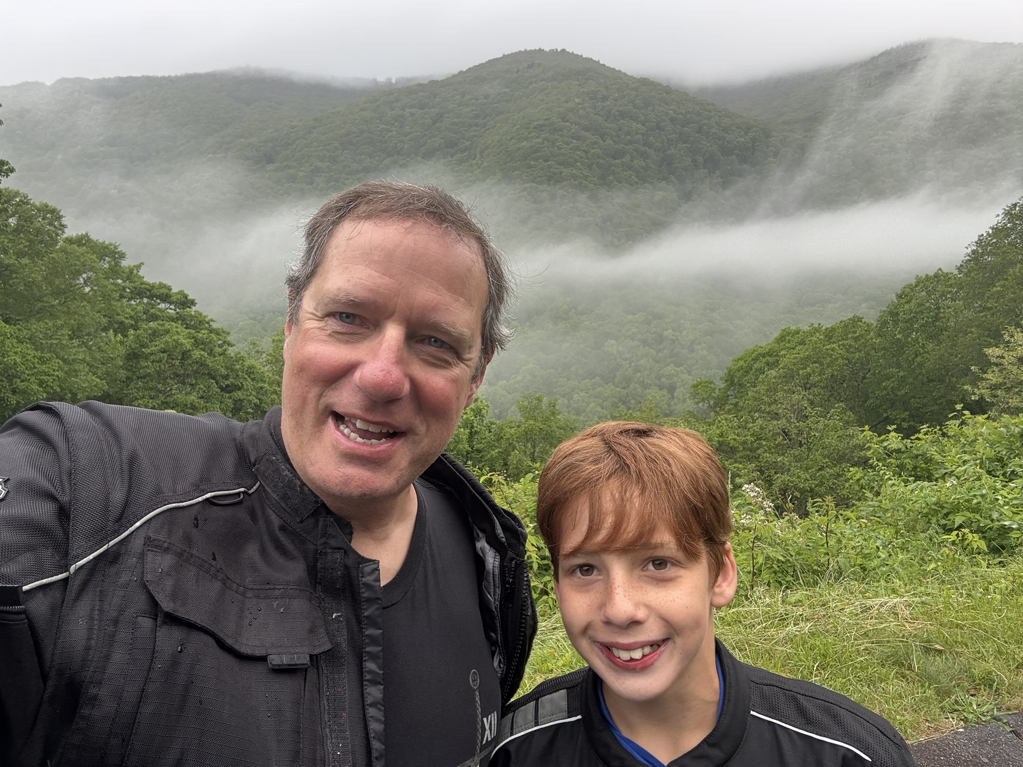 Tim and Michael with foggy mountains