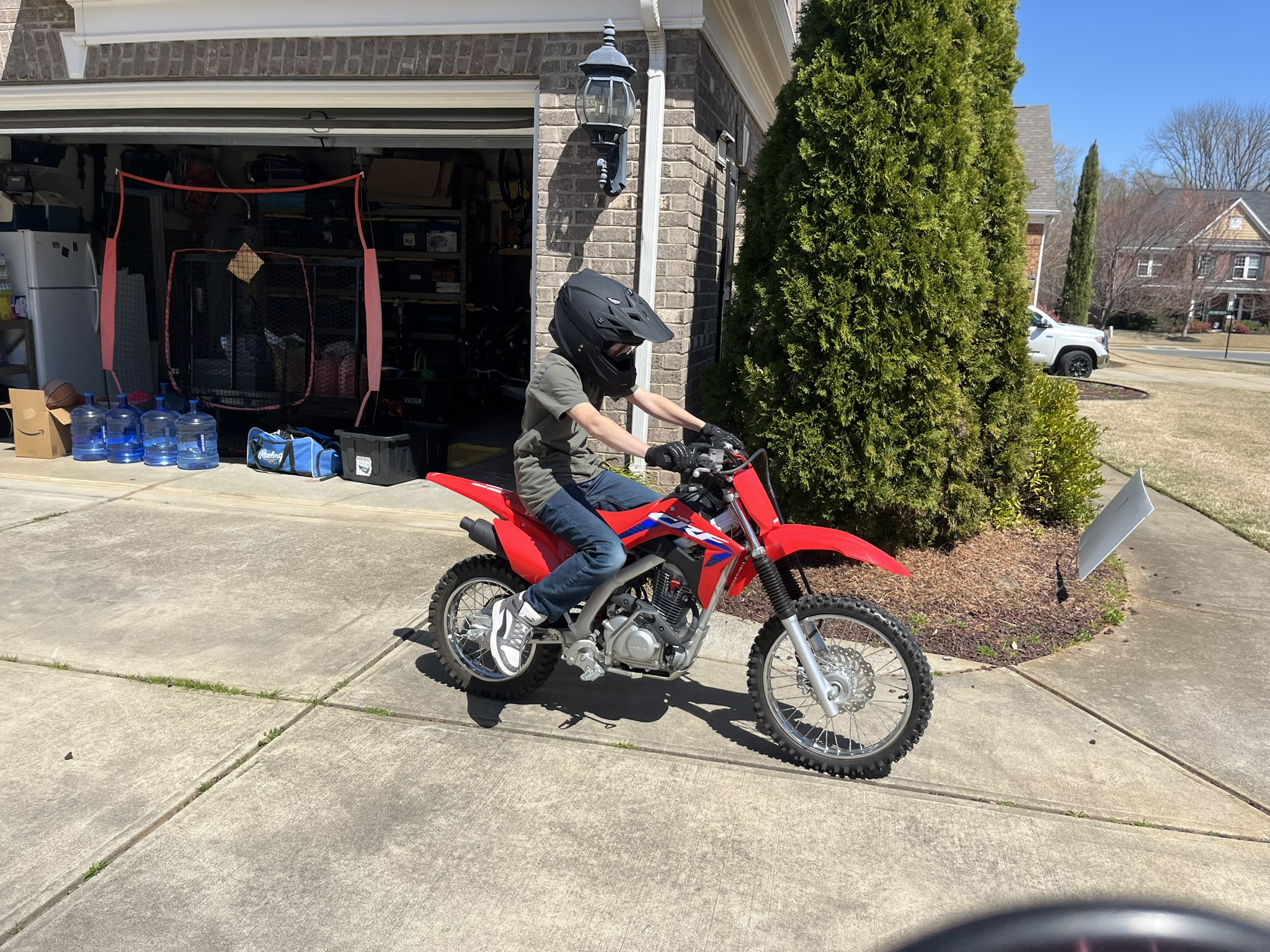 Michael riding Honda side view