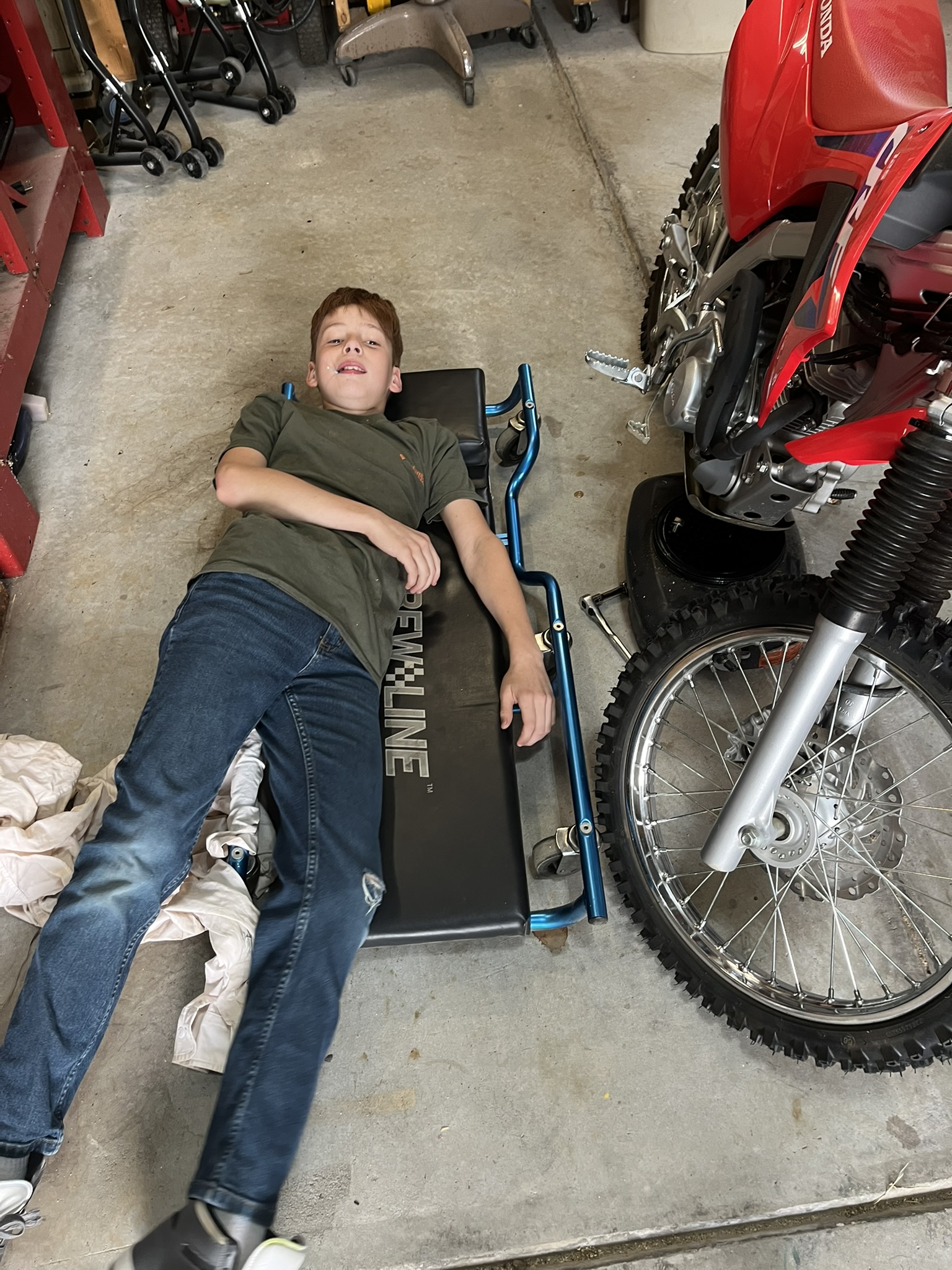 Michael and dirt bike in garage